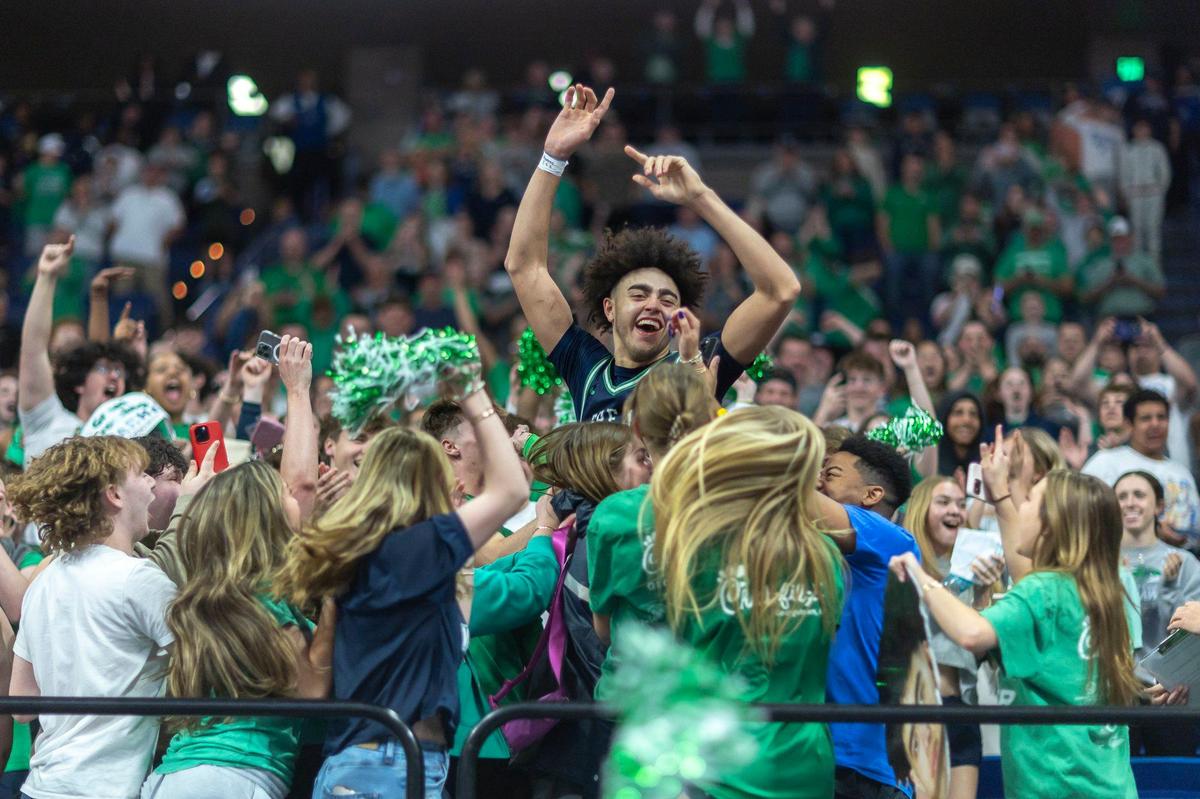 Great Crossing’s Malachi Moreno celebrates with the Warhawks’ student section following the Sweet 16 state championship game at Rupp Arena on Saturday.
