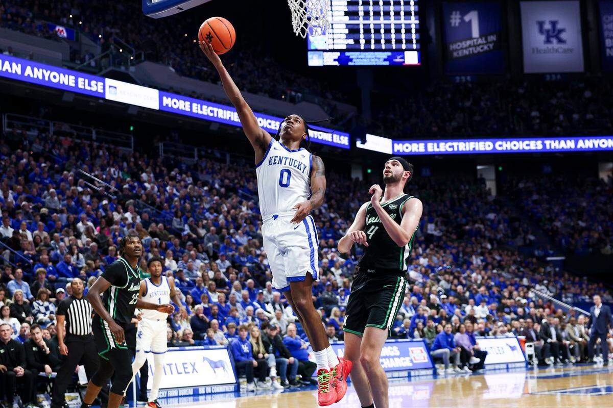 Kentucky’s Rob Dillingham (0) shoots against Marshall’s Jacob Conner (4) during Friday’s game at Rupp Arena. Dillingham finished with 16 points, five rebounds and eight assists.