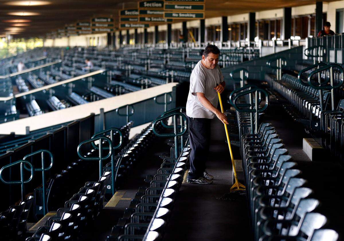 Francisco Barberna mopped the grandstand early Wednesday at Keeneland Race Course. Keeneland’s 2018 Fall Race Meet opens Friday and continues through Oct. 27.