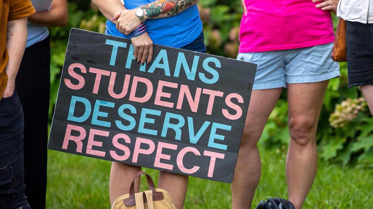 More than a dozen people attend a rally in support of trans youth in schools on Monday, June 26, 2023, outside the Fayette County Public Schools central office in Lexington, Ky. Speakers at the rally asked the Fayette Board of Education to support transgender students, specifically with changes to school bathrooms.
