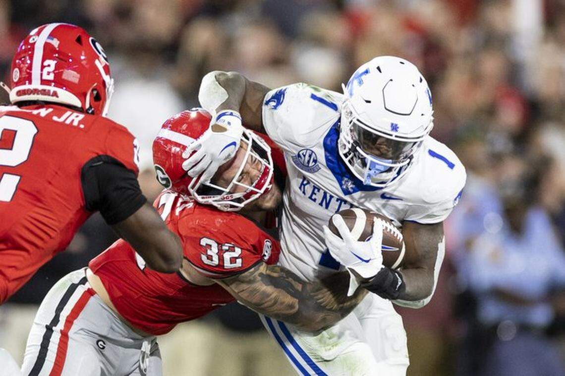 Kentucky’s Ray Davis (1) has rushed for 1,066 yards and scored a school record 20 touchdowns this season.