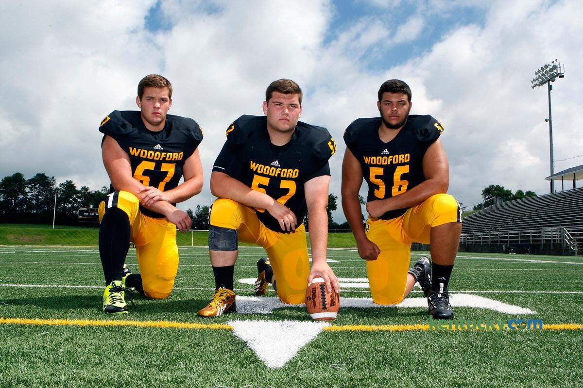 Kentucky center Drake Jackson (middle) and Vanderbilt left guard Saige Young (right) were teammates at Woodford County High School.