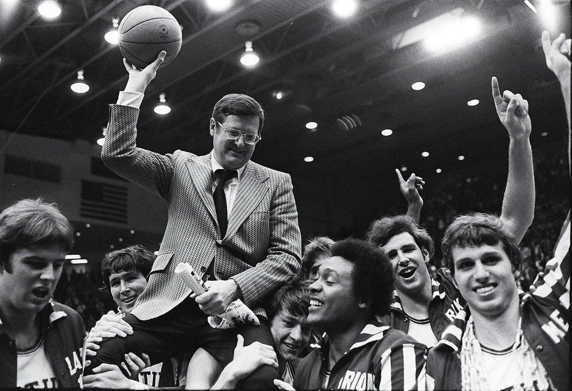 Kentucky Coach Joe B. Hall was carried off the floor after UK beat Indiana 92-90 in the 1975 NCAA Tournament Mideast Regional finals in Dayton, Ohio. The UK players, from the  left were: Danny Hall, Rick Robey, Jimmy Dan Conner, Marion Haskins, Mike  Phillips and Mike Flynn.
