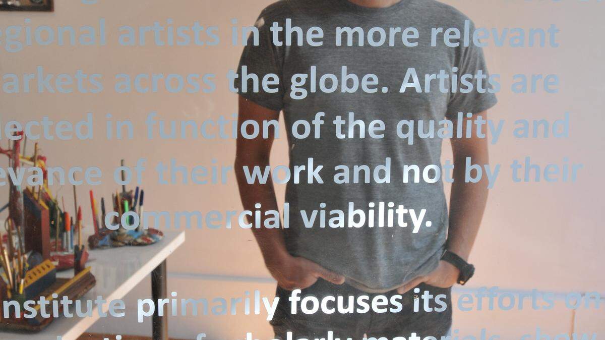 Phillip March Jones, owner of Institute 193 at 193 North Limestone, has the gallery's mission statement on its glass door. Institute 193 is celebrating its first anniversary this month. Jones describes the  gallery as a think tank.   
