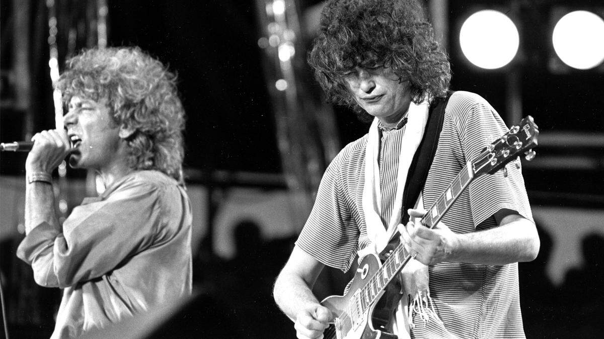 Led Zeppelin’s Robert Plant and Jimmy Page perform at Live Aid on July 13, 1985. The band’s 1976 concert album, “The Song Remains the Same” is being released in a deluxe edition Sept. 7.