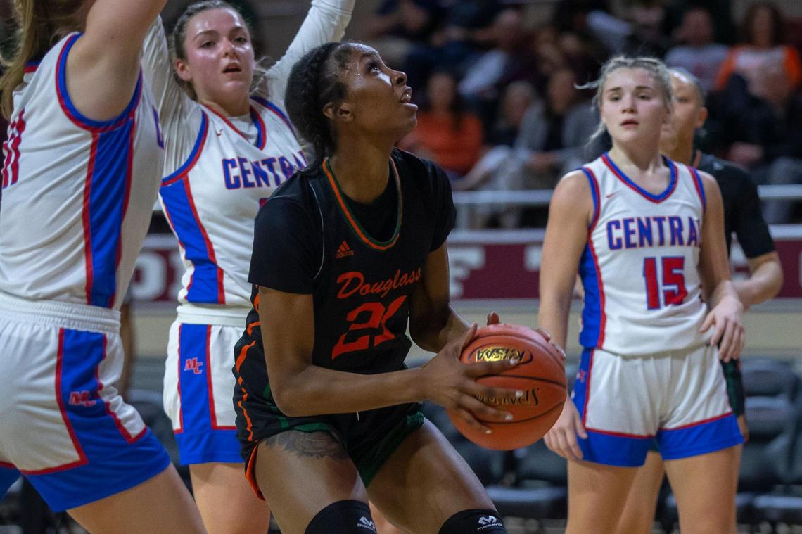 Frederick Douglass’s Ayanna Darrington (21) looks to shoot the ball during the 11th Region semifinals against Madison Central at Baptist Health Arena at Eastern Kentucky University in Richmond, Ky., on Wednesday, March 1, 2023.