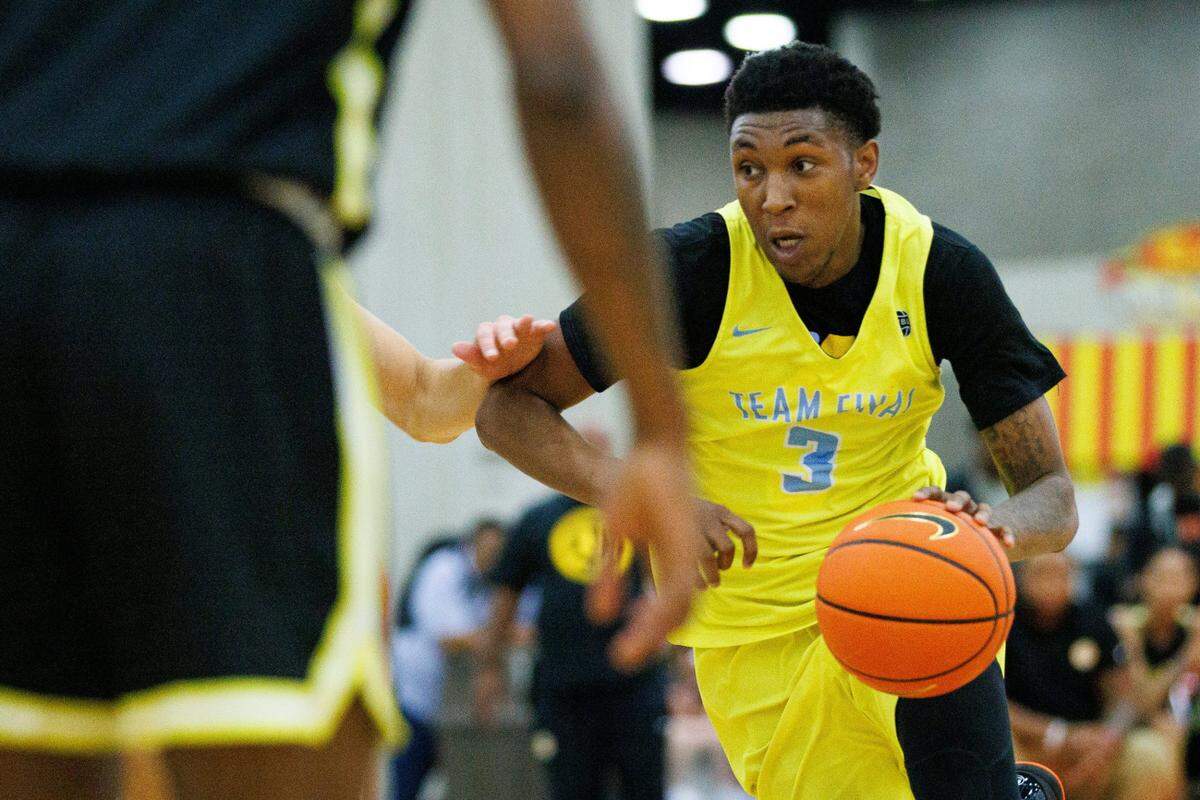 Team Final’s Justin Edwards (3) drives the ball into the paint during the first day of the Nike Elite Youth Basketball League session on May 28 at the Kentucky Exposition Center in Louisville. Edwards, a class of 2023 recruit, committed to UK in July.