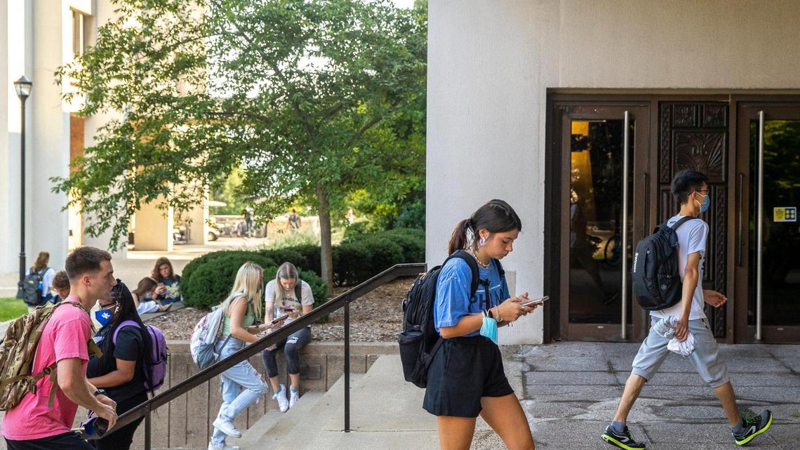 Students walk outside the White Hall Classroom Building on the University of Kentucky campus in Lexington, Ky., on the first day of classes for the fall semester Monday, Aug. 23, 2021.