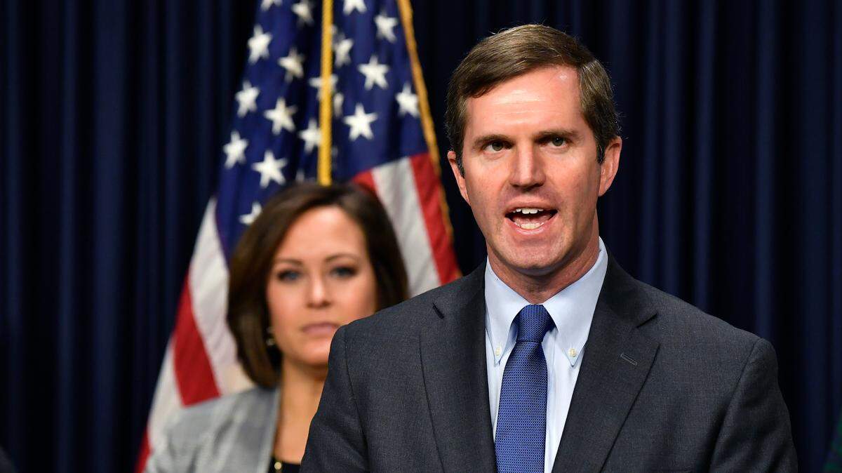 FILE PHOTO: Kentucky Gov. Andy Beshear, right, and Lt. Gov. Jacqueline Coleman speak with the media during a press conference at the Kentucky state Capitol in Frankfort, Ky., Tuesday, Jan. 7, 2020.