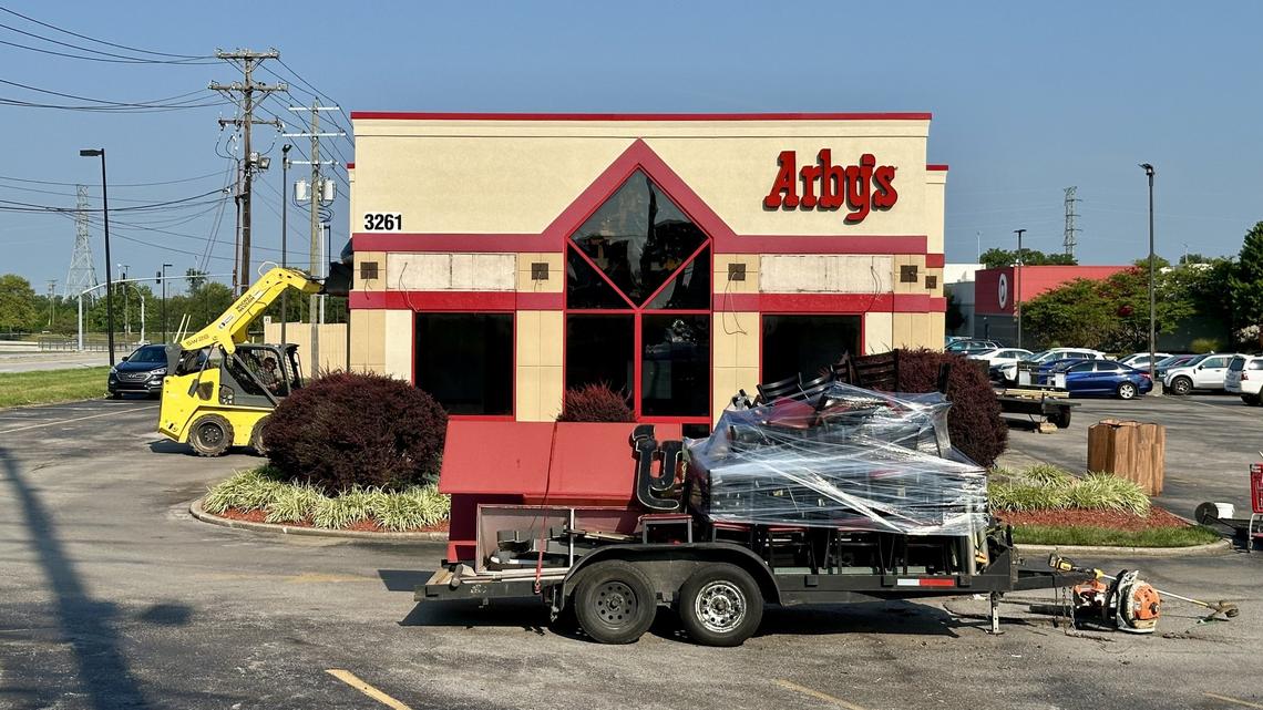 Workers with Whittaker Enterprises take down signage at the Arby’s restaurant at 3261 Nicholasville Rd. Monday, Aug. 5, 2024 in Lexington, Ky. The fast-food restaurant opened at the high-profile intersection of Nicholasville and Reynolds Road in 1980.