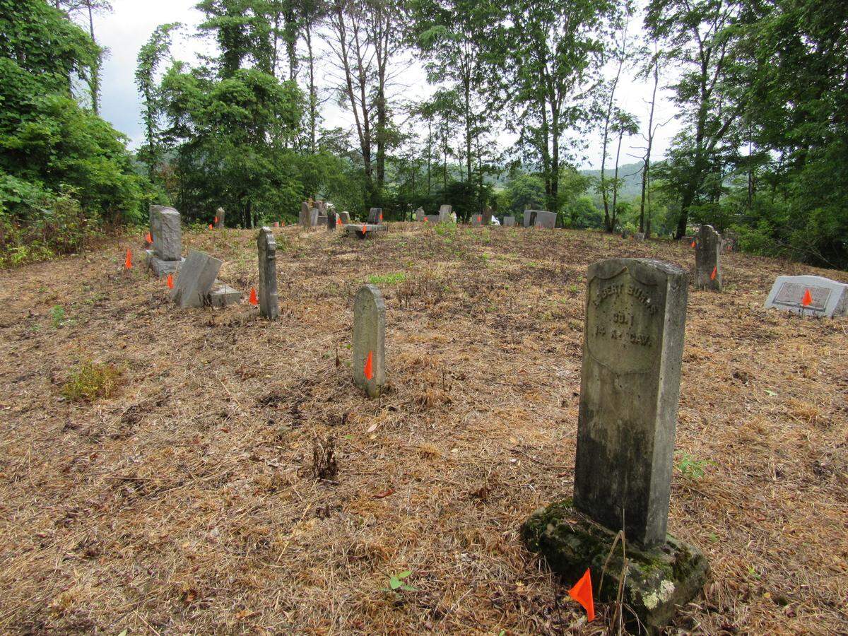 The Hoskins Cemetery atop a hill in Manchester has the graves of several veterans. The headstone at right is for Robert Burns, a Civil War veteran who died in the 1890s.