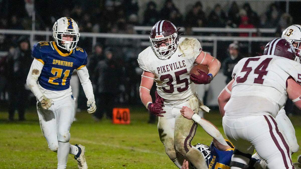 Pikeville’s Brenden Anthony (35) looks for running room during Friday night’s Class A playoff defeat at Sayre.