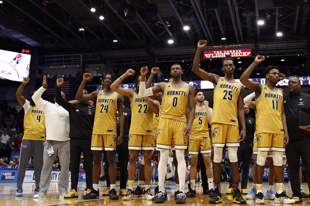 Mar 18, 2025; Dayton, OH, USA;  The Alabama State Hornets gesture to the crowd after defeating the St. Francis (Pa) Red Flash at UD Arena. Mandatory Credit: Rick Osentoski-Imagn Images