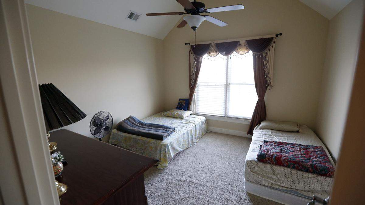 An upstairs bedroom at the house of Amrutlal and Dakshaben Patel on Ellerslie Park Boulevard is where the couple housed Indian nationals who were working for them at Subway franchises in Lexington, according to defense attorney Mark Wohlander.