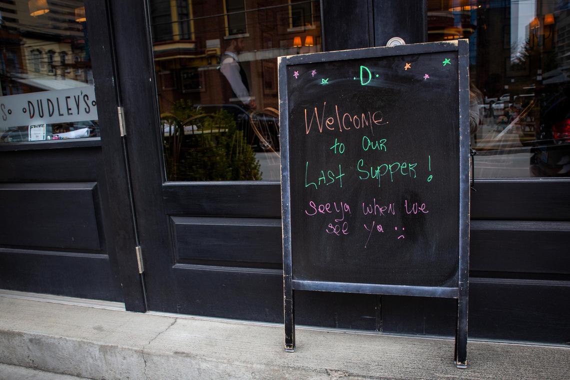 A sign Monday outside Dudley’s On Short Street let customers know of their closing. Governor Andy Beshear called for the closure of all restaurants and bars’ dine-in service due to the current coronavirus scare.