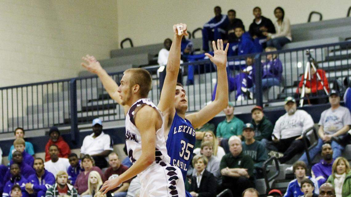 Lexington Catholic's Craig Floyd (35) shot the game-winning, three-pointer against Kody Johnson and Pulaski County. LexCath hit 10 of 25 threes as a team, while the Maroons were 10-for-22.   