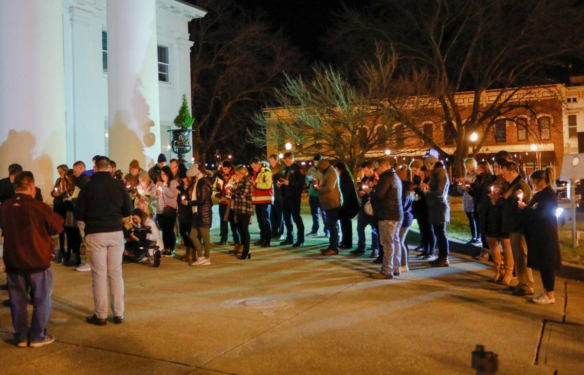 Mourners pray during a vigil for Jordan Morgan at the Madison County Courthouse in Richmond, Ky. Morgan was killed in a shooting at her father’s home a few days earlier. Photo by Pablo Alcala