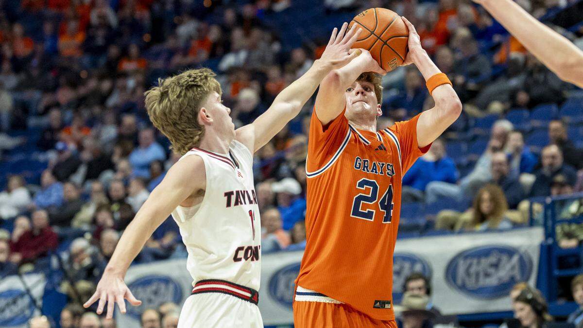 Grason County's Jack Logsdon (24) makes a three-pointer over the outstretched arms of Taylor County's Jaron Johnson (1) during a first-round game in the 2026 UK Healthcare Boys' Basketball Sweet 16 state tournament, Wednesday, March 18, 2026 at Rupp Arena in Lexington, Ky.