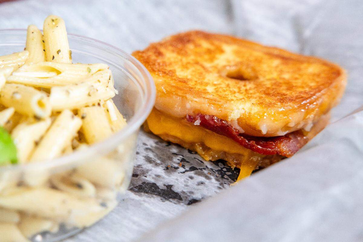 The Sinker is a glazed doughnut filled with Cheddar Cheese and bacon. Pair with tomato soup and that could be breakfast or lunch.