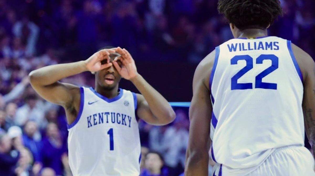 Kentucky’s Lamont Butler (1) celebrates after making a shot against Louisville on Saturday at Rupp Arena.