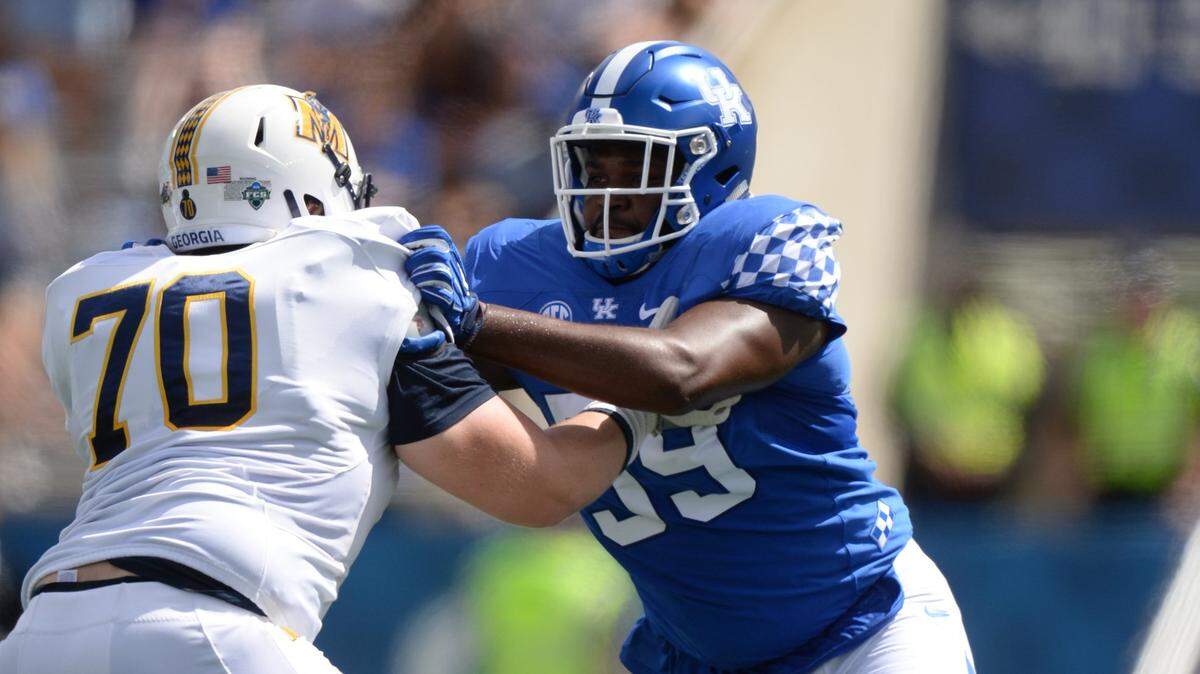 He had hoop dreams. An ex-Cat helped this UK lineman rediscover football.