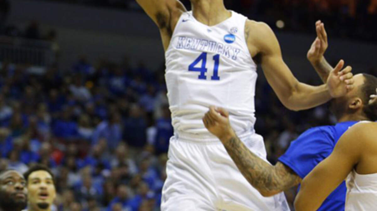 Trey Lyles throws down a dunk in the first half of the Kentucky-Hampton NCAA Tournament game in Louisville Thursday night.