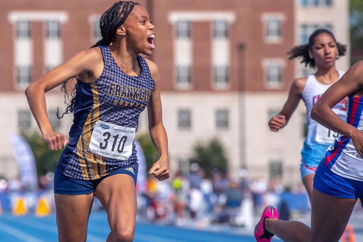 Franklin County’s Shavi Kennedy celebrates after winning the girls’ 100 at the KHSAA Class 2A state meet.