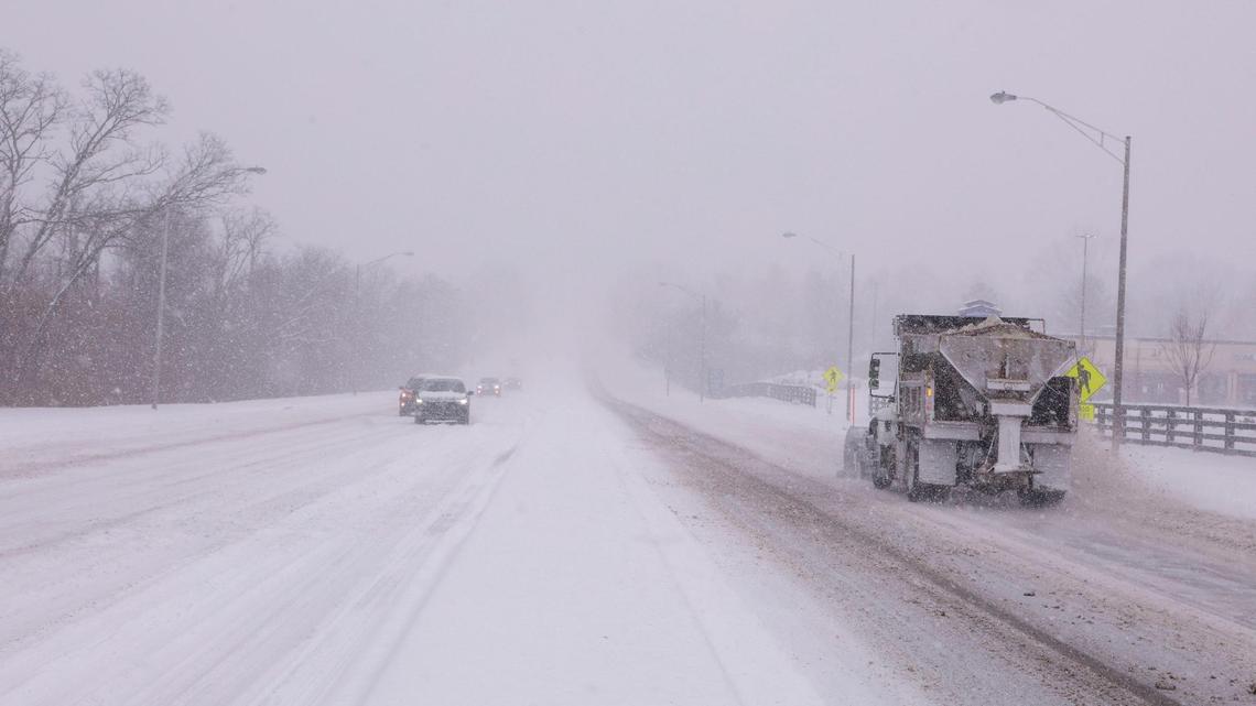 A city of Lexington snow plow truck makes its way down Man o’War Boulevard near Pimlico Parkway during a winter snowstorm, Sunday Jan. 5, 2025 in Lexington, Ky.