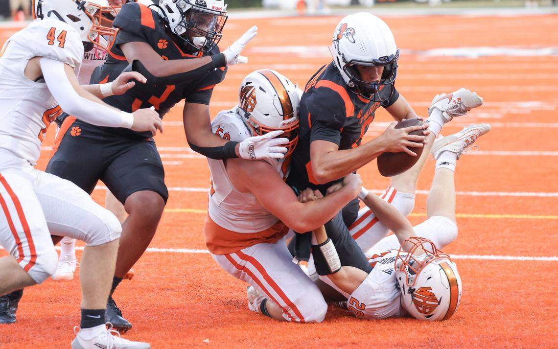 Paris quarterback Guy Turner plunges forward in the first quarter against Williamsburg during a game at Blanton Collier Stadium in Paris on Aug. 29. He scored both Paris TDs in its 14-10 win over Sayre last week. 