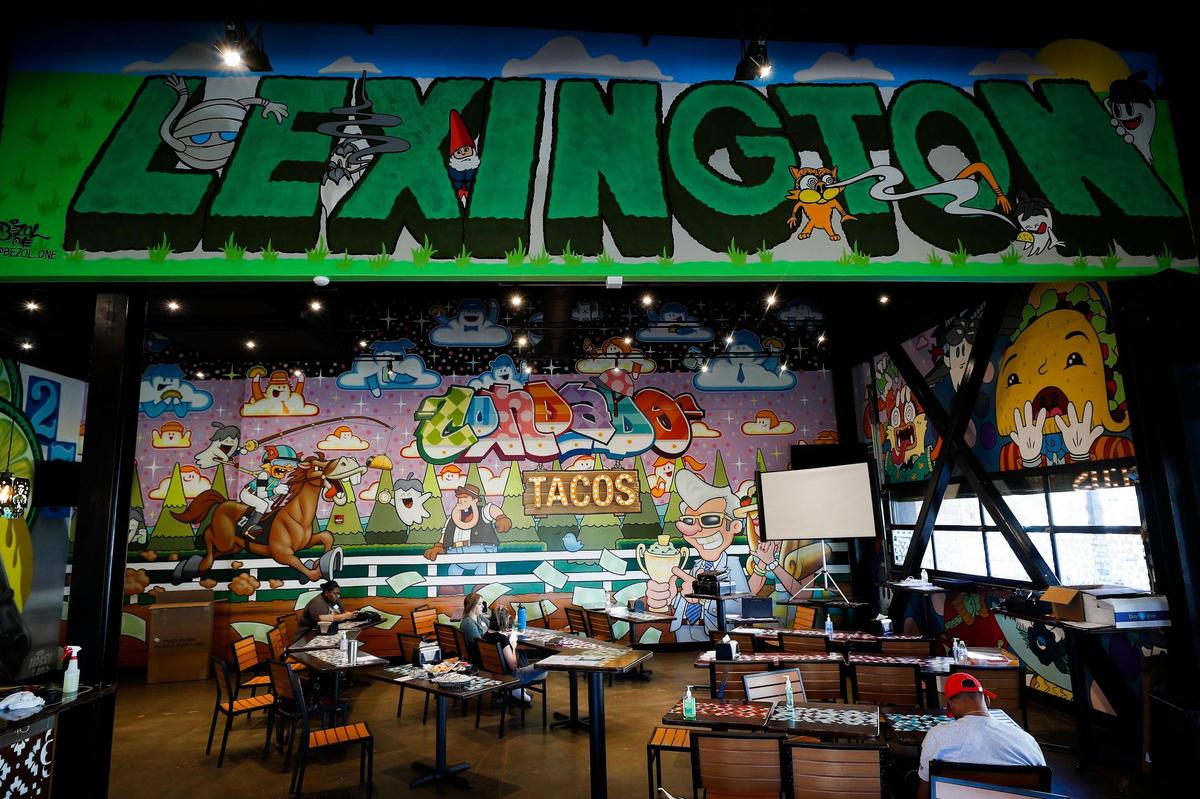 The dining room at Condado Tacos at The Summit at Fritz Farm. Each location is decorated with special with murals and Lexington’s includes nods to horse country.