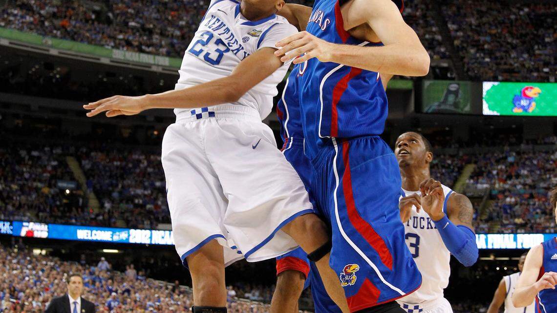 Anthony Davis (23) of the Kentucky Wildcats was fouled by Thomas Robinson (0) of the Kansas Jayhawks in second half action in the championship game of the NCAA Final Four basketball tournament Monday, April 2, 2012, in New Orleans. Photo by Mark Cornelison | Staff