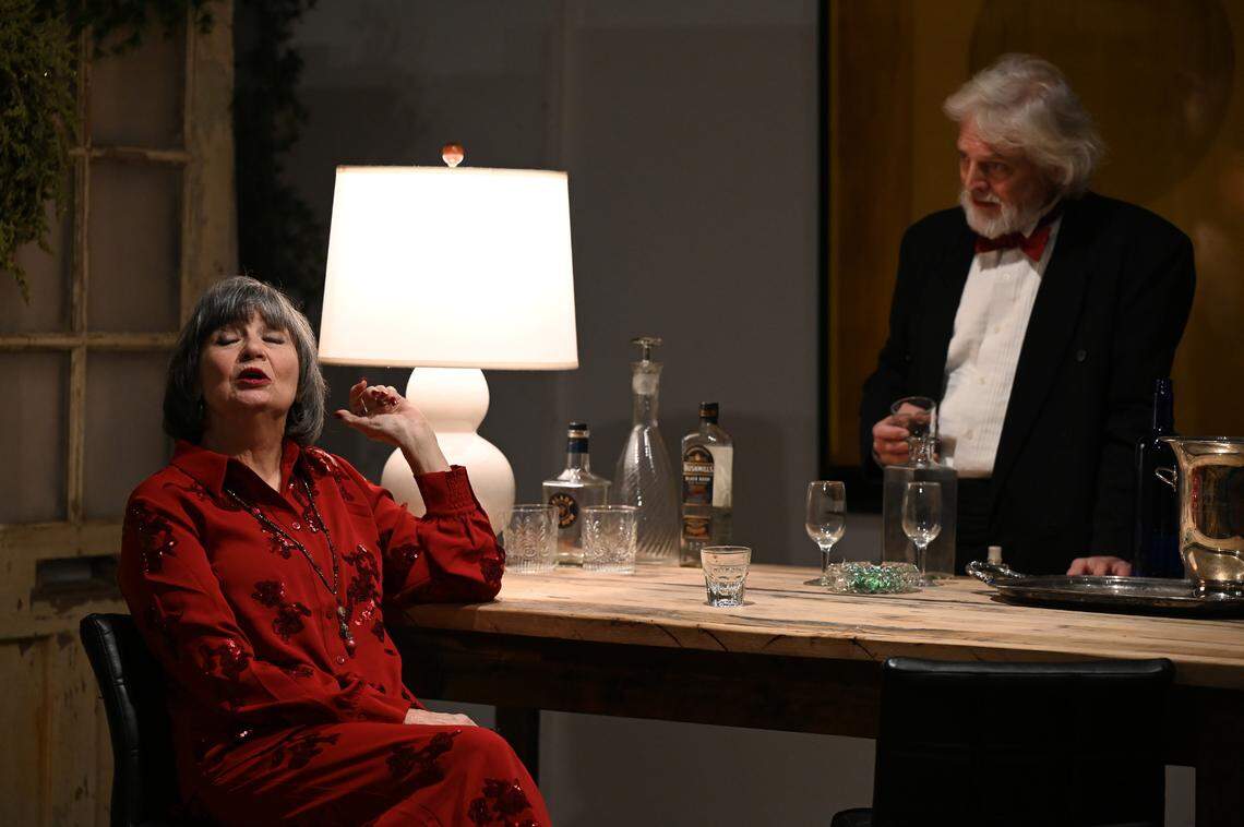 Estranged spouses Eleanor (Missy Johnston) and Henry (Kevin Hardesty) engage in some verbal jousting over drinks. On the Verge Theatre presents “The Lion in Winter” at Luigart Studio, 110 Luigart Court in Lexington, Kentucky, Jan. 23-Feb. 1. This photo was taken at a rehearsal Jan. 17, 2025.