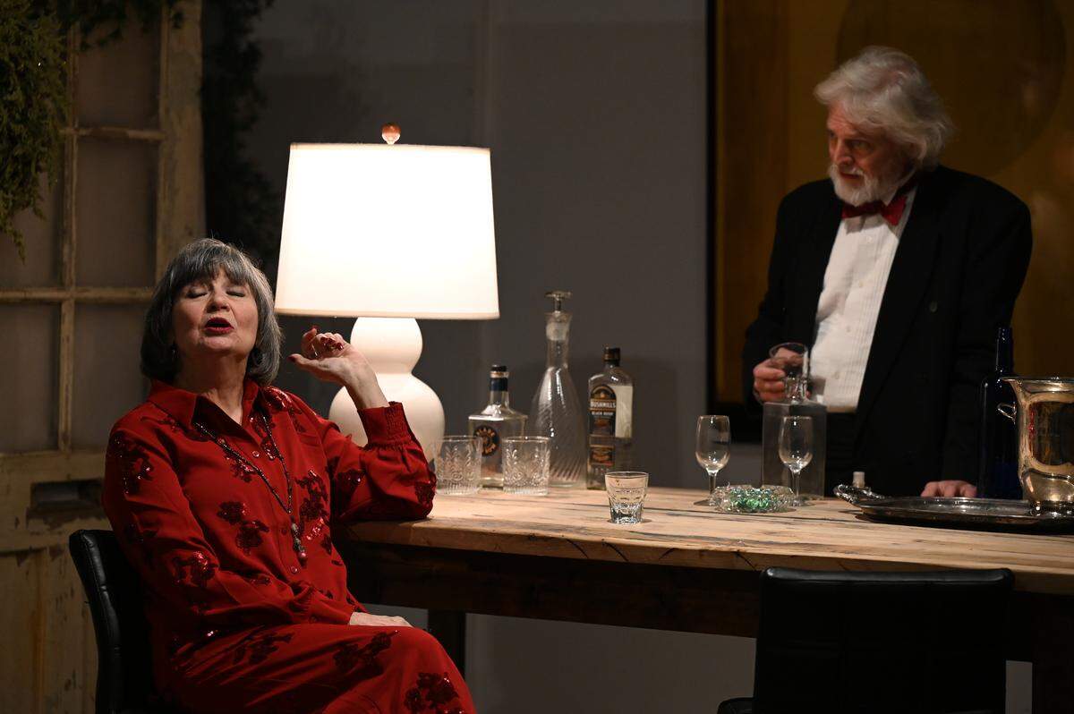 Estranged spouses Eleanor (Missy Johnston) and Henry (Kevin Hardesty) engage in some verbal jousting over drinks. On the Verge Theatre presents “The Lion in Winter” at Luigart Studio, 110 Luigart Court in Lexington, Kentucky, Jan. 23-Feb. 1. This photo was taken at a rehearsal Jan. 17, 2025.