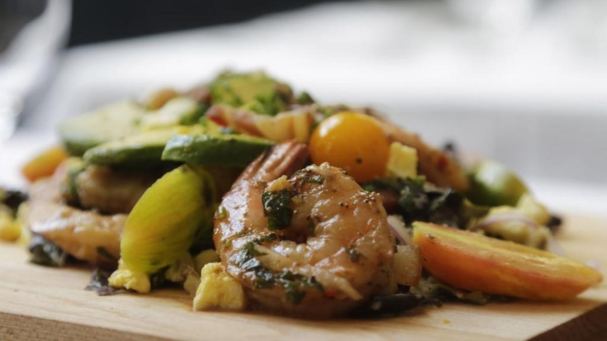 Lockbox Cobb salad has Gem lettuce, avocado, pickled shrimp, hard-boiled egg, blue cheese and bacon with red onion.