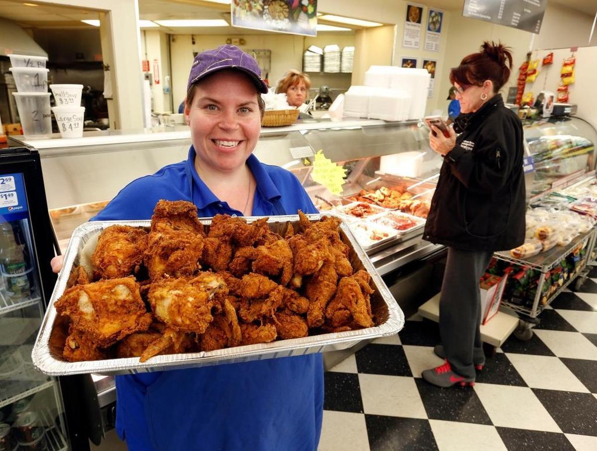 Deli Manager Dessi Comley held a tray of fried chicken during lunchtime in 2018 at Save-A-Lot, 398 Southland Drive in Lexington. They have a reputation as having the best fried chicken in town.