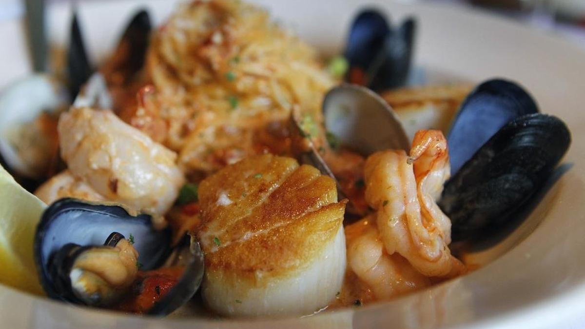 Frutti Di Mare features scallops, shrimp and lobster tossed with linguine in a sherried mascarpone tomato cream sauce at Giuseppe’s Ristorante Italiano in Lexington, Ky., Tuesday, July 25, 2017.