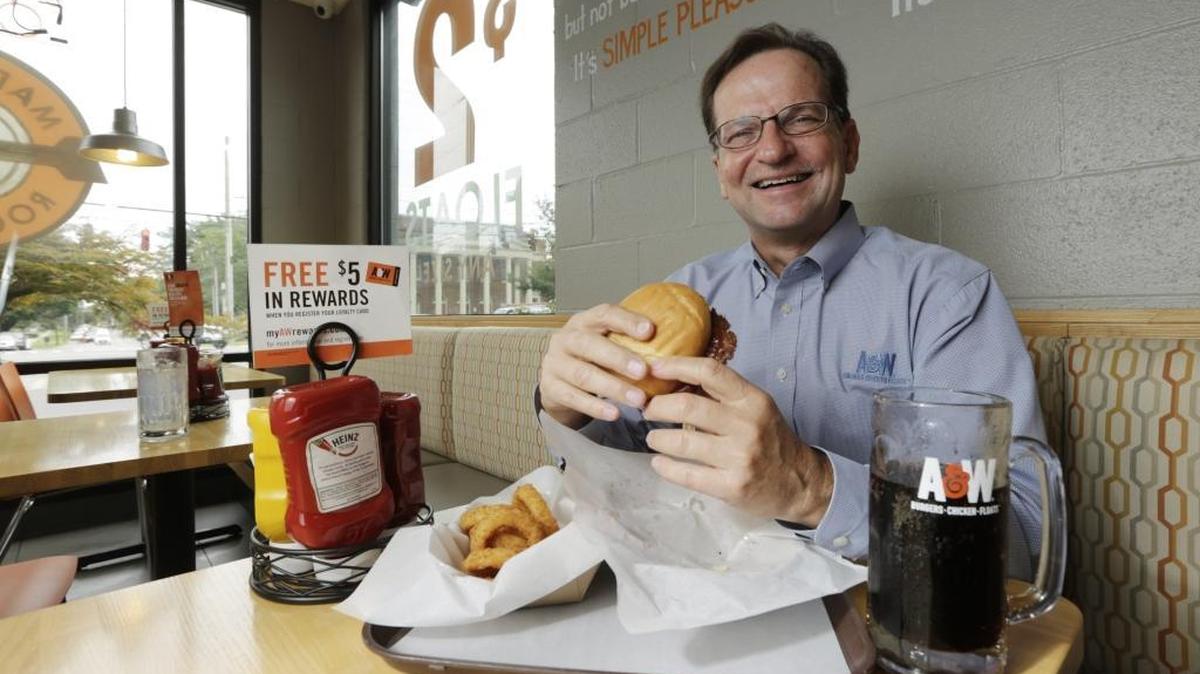 Kevin Bazner, president and CEO of A&W Restaurants, had lunch – a burger cooked and dressed to order – at the Main Street location in Lexington. He credits store-made root beer, National Root Beer Float Day and great burgers with turning the chain around five years after Yum sold it off.