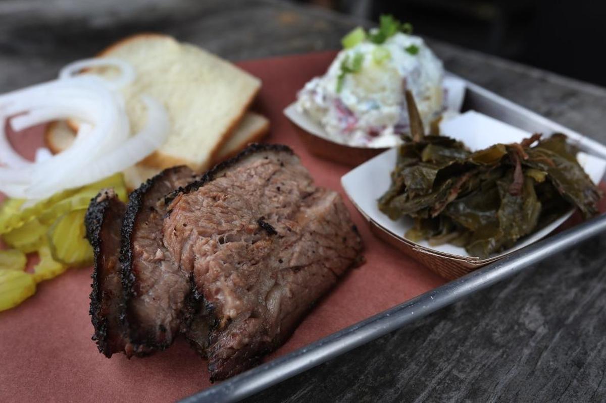 Don’t feel like cooking? Blue Door has tailgating packages, such as a brisket platter with greens, potato salad, sandwich bread, onions and pickles.