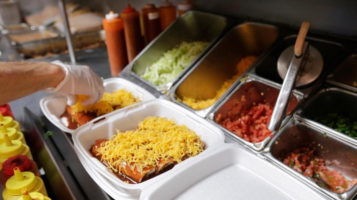 Assistant manager Todd Carman made to go orders of enchiladas at Taco Tico on Boardwalk in Lexington, Ky, on Aug. 26, 2016. Taco Tico has been at the same location since 1973 and is thought to be Lexington’s first fast food taco restaurant.