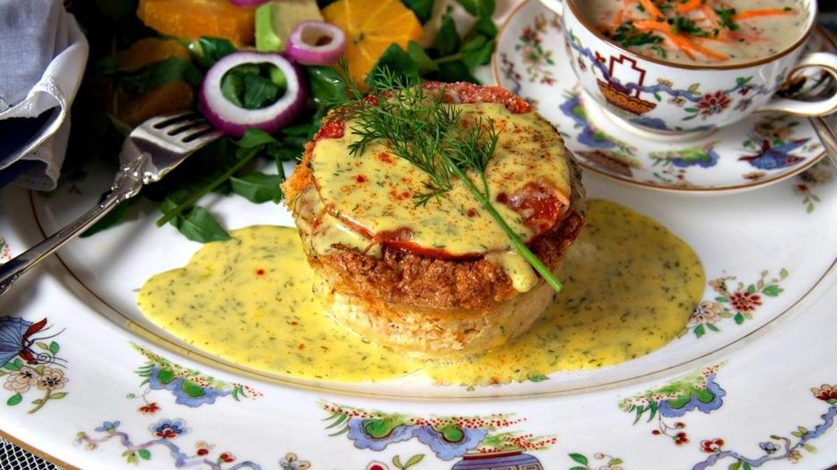 The luncheon menu for The Glitz includes the salmon souffle for an entree. It features fresh flaked Atlantic salmon with herbs topped with sliced tomato and Parmesan, baked in a souffle and drizzled with Hollandaise sauce.