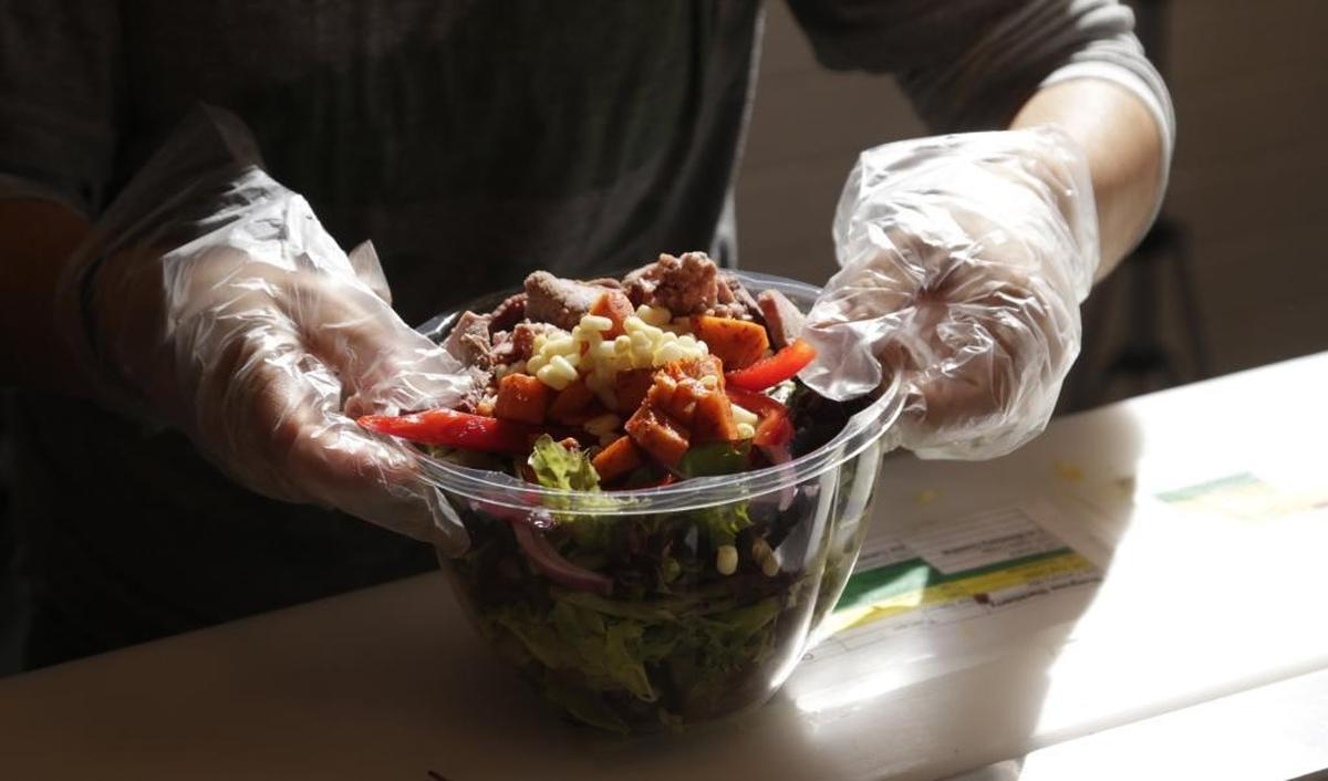 Alma Cortillo fixed a salad order at Vinaigrette Salad Kitchen on Sharkey Way in the Townley Center development in Lexington in 2015. The local restaurant chain started in 2014 and has locations in Lexington and Louisville.