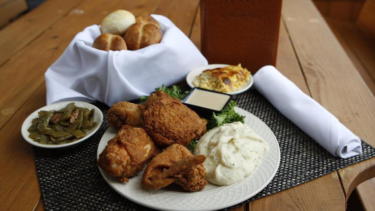 Fried chicken with green beans, mashed potatoes, corn pudding and warm rolls at Merrick Inn in Lexington.