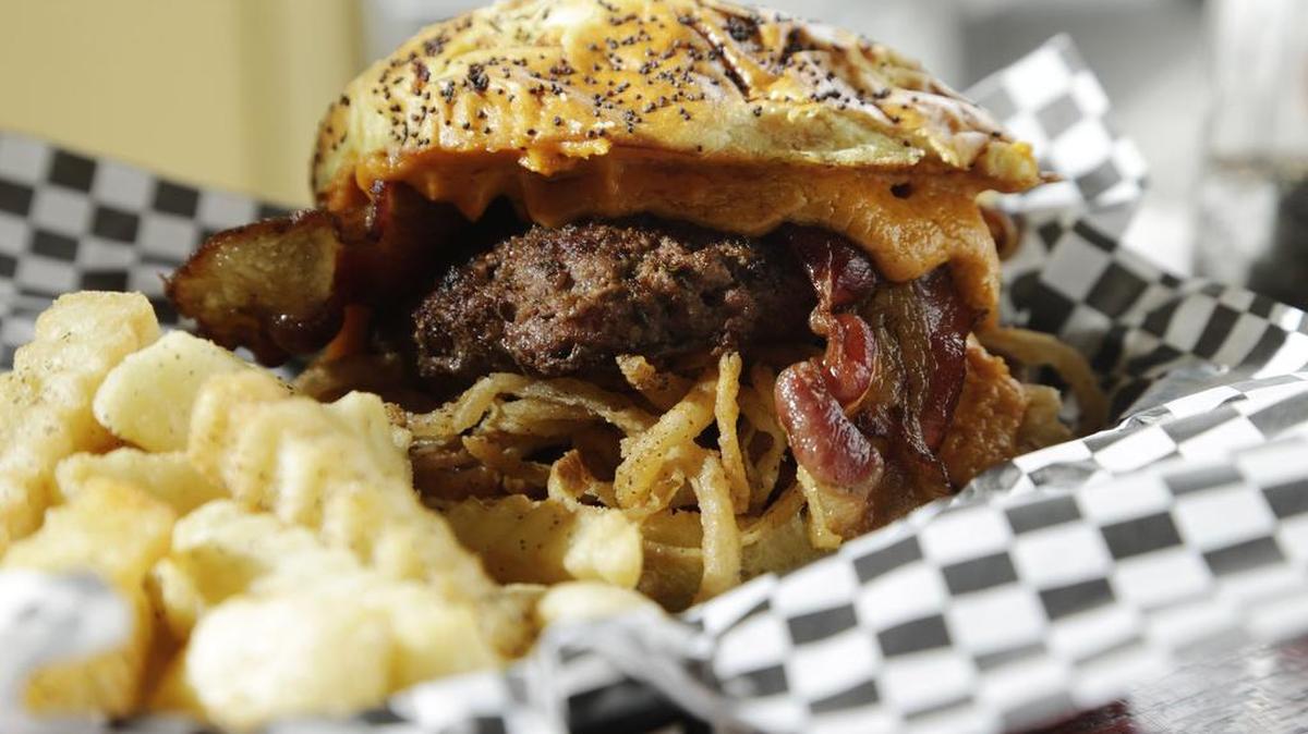 The Bad Wolf burger (onion straws, beer cheese, bacon) is the signature sandwich at Bad Wolf Burgers on Leestown Road, in the former Meadowthorpe Café.