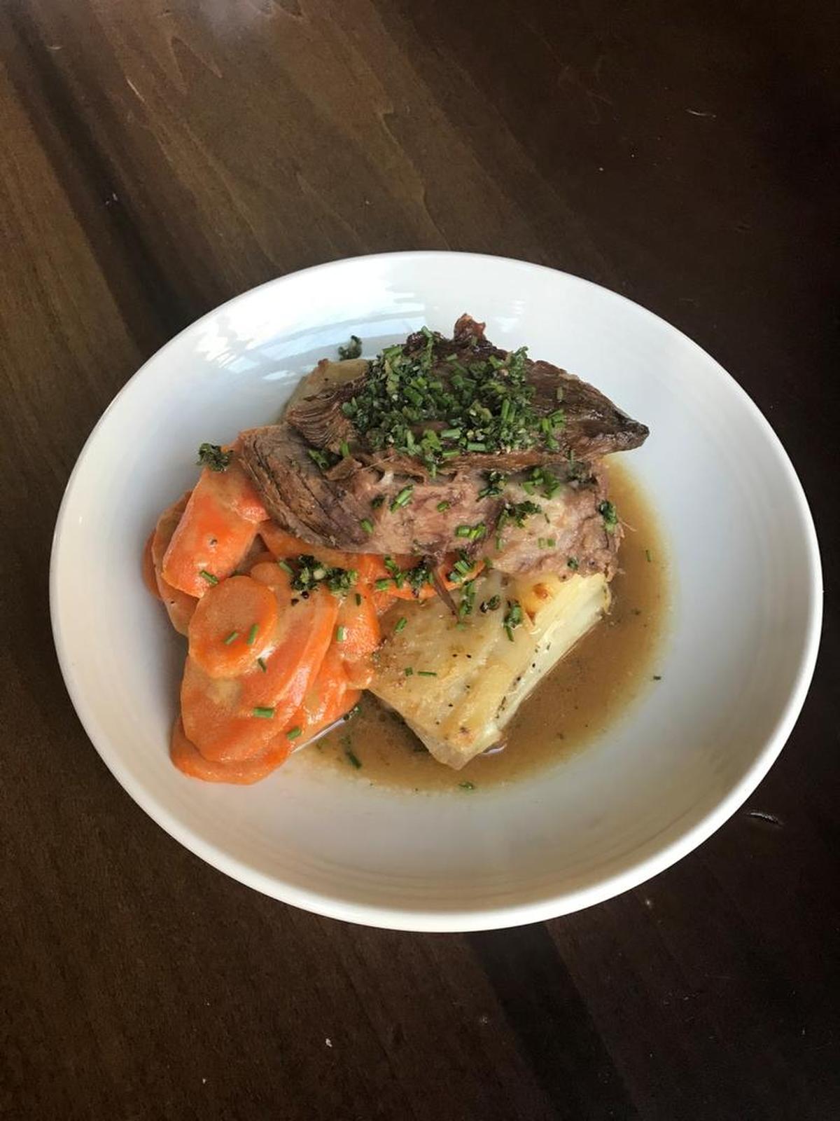 Kentucky-raised beef pot roast slow-cooked overnight in red wine and mirepoix, served with potato gratin and honey-glazed carrots, is among the comfort foods recently added to the menu at Honeywood.