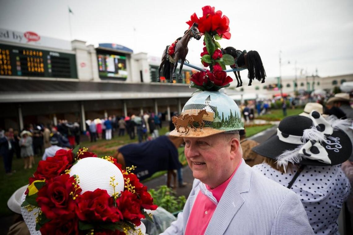 Skip Koepnick, of Wyoming Mich., watches horses circle the paddock as horses circle his head at the 2017 Kentucky Derby.