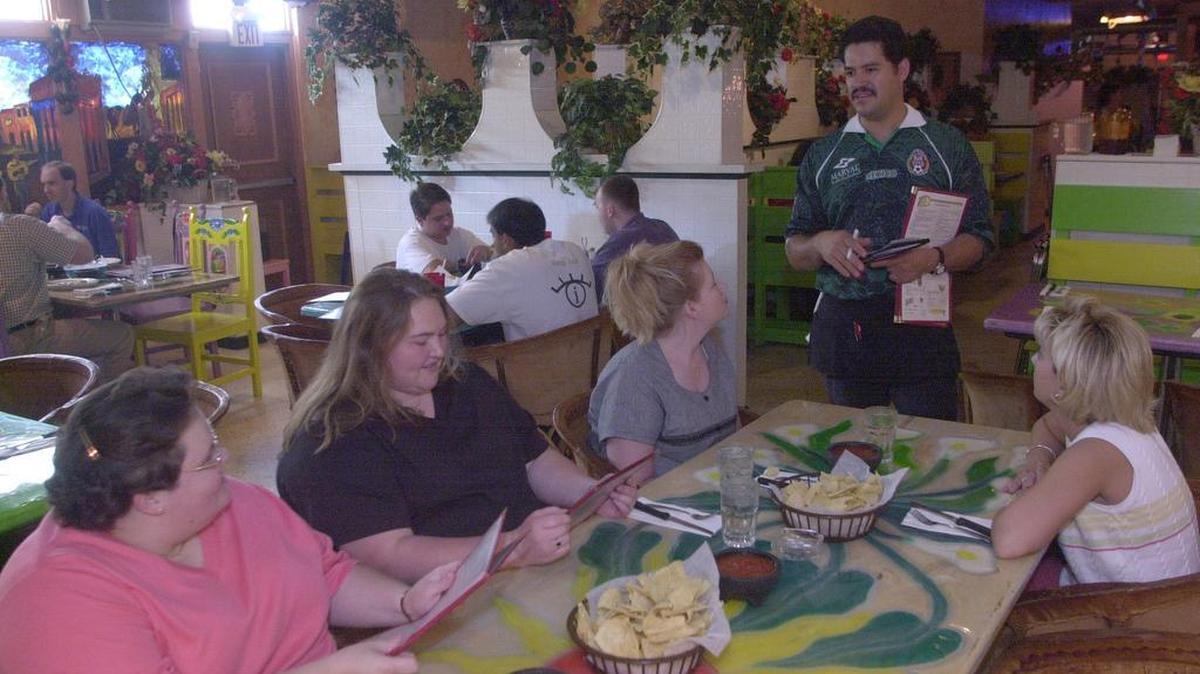 At Jalapeño’s restaurant, Ismael Nevarez (standing) takes lunch orders from Chatika Stull, left, Mount Sterling; Holly Clagg, Corinth; Bendrea Wilson, and Jodi Hudnall, right, Georgetown on May 21, 2001.
