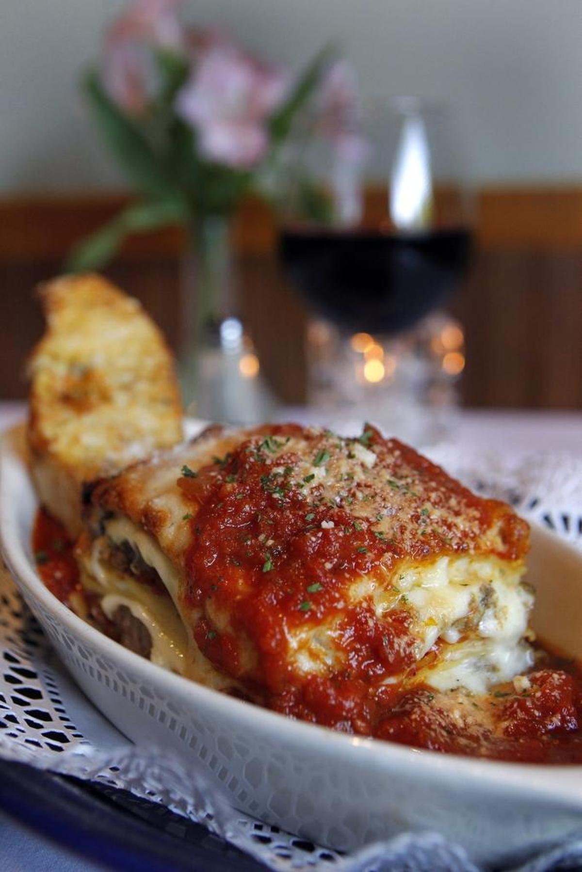 Lasagna features baked layers of ribbon pasta, ricotta, mozzarella, provolone, parmigiana, ground sirloin, Italian sausage and marinara served with garlic bread at Giuseppe’s Ristorante Italiano in Lexington.
