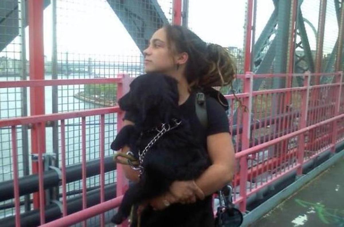 Martha Tillson with her dog, on the road.