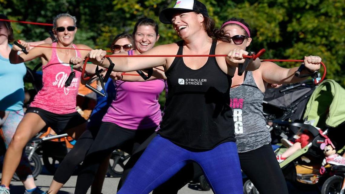 Lindsay Galvin led the class in a band workout during a Fit4Mom class held in Veterans Park in Lexington recently. Fit4Mom is a company with a Lexington franchise that works out of Veterans Park. Moms and moms-to-be meet at the park several times a week for group exercising. The moms have their kids in strollers while they exercise.