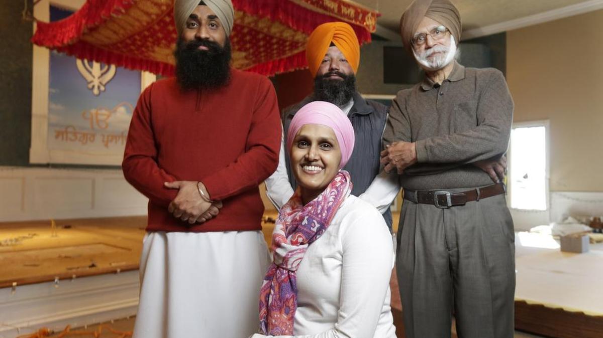Standing from left, Bhaiji Devinder Singh, Bhai Jaswant Singh and Surjit Singh Dhooper and Sudha Chopra posed in the nearly complete worship house at the Sikh Association of the Bluegrass.